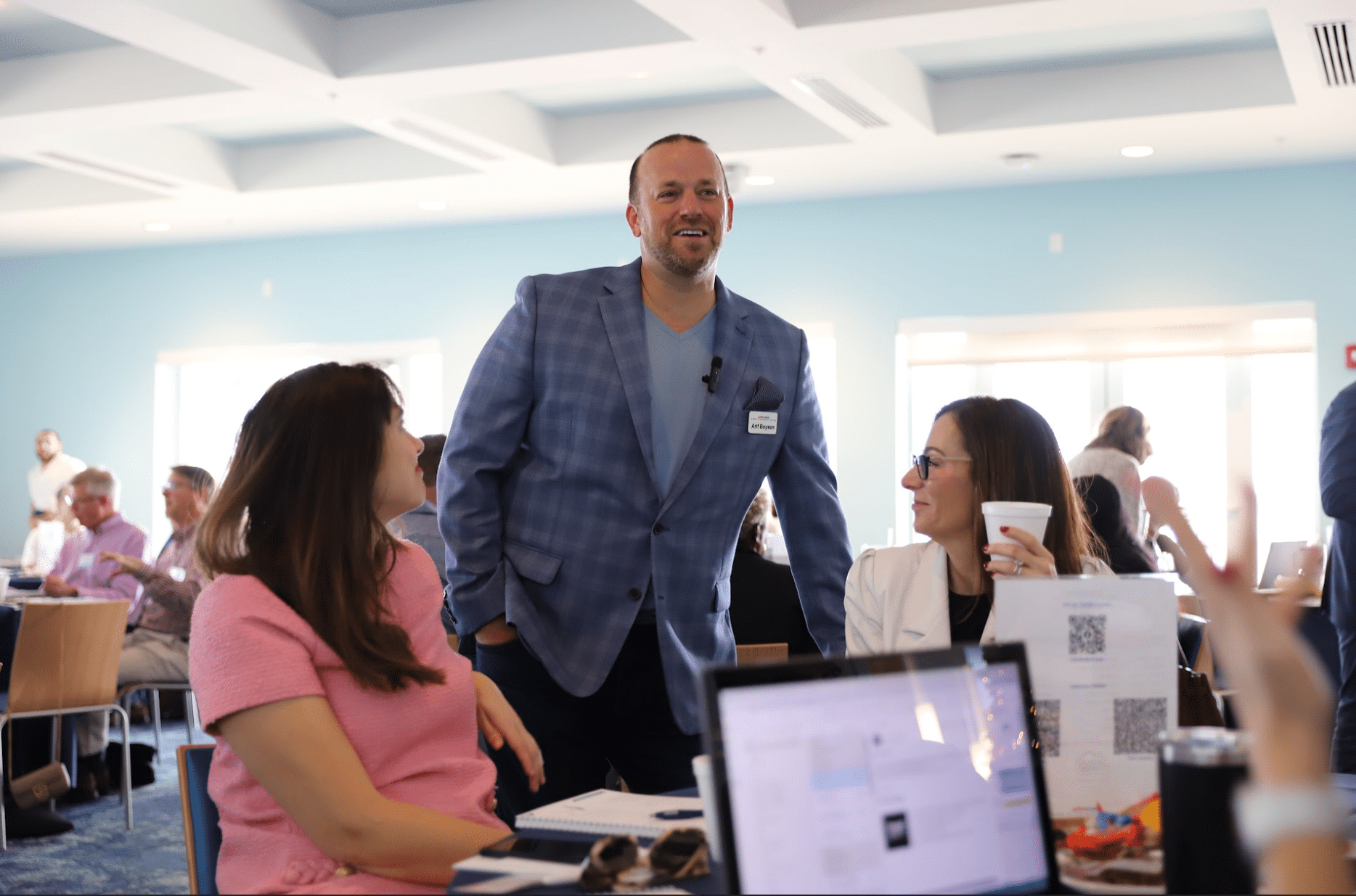 business coach speaking to clients FAQs